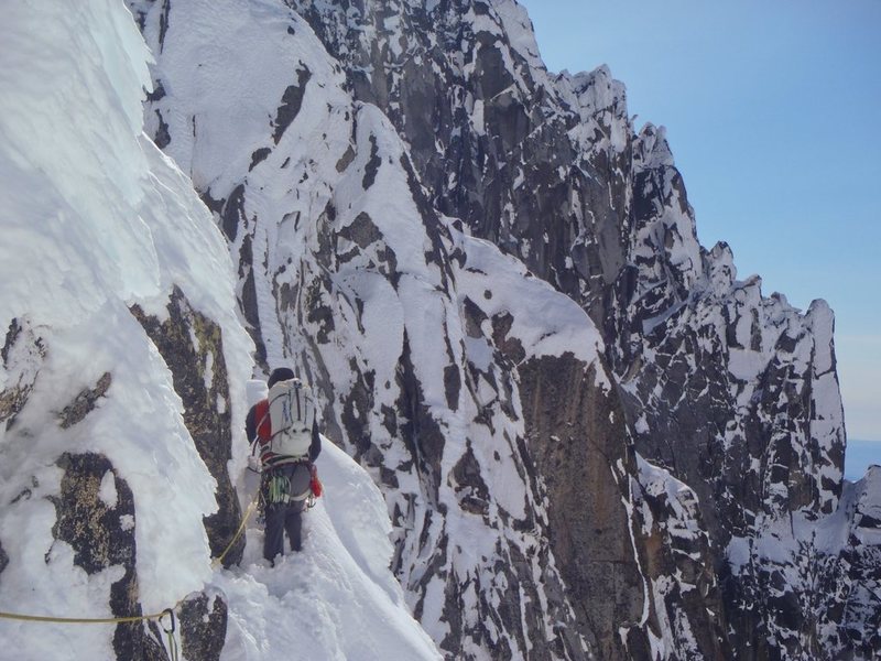 Joe leading out on the first pitch of the West Ridge across ledges.