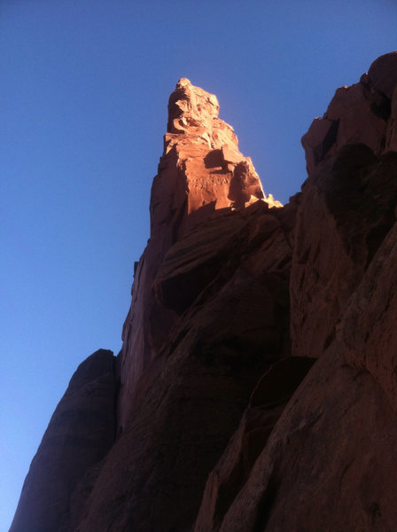 Looking back up at Monster Tower as the sun's glow hits the upper reaches of the tower.