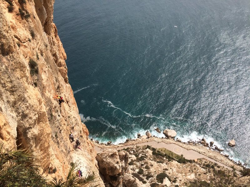 Climbers heading up pitch 6 of Costa Blanca on the Peñon D'Ifach.