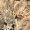 José Ortega surmounts the overhang on pitch 5 of Costa Blanca on the Peñon D'Ifach in Calpe, Spain.