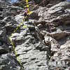 Scramble to bolt/to some fun climbing above, short, most challenging at the top