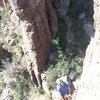 Russell belaying from the chains of Drop'em South.