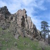 A prominent fin of schist on the south side of the North Laramie River where the trail crosses the North Laramie River going upstream. 