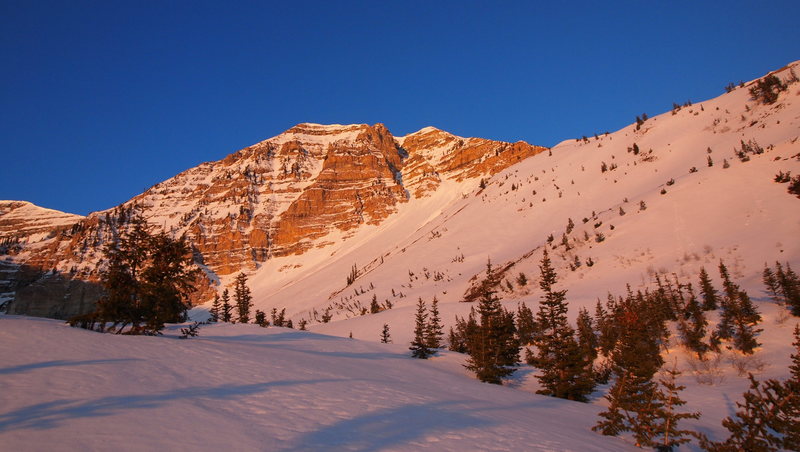 Grunge Couloir is on the right end of the mountain as pictured. Look for 2 forks that form what looks like a wishbone. The two forks meet 2/3 of the way up at which point the couloir steepens and jogs right. Exiting the couloir you'll encounter the crux face (60+ degree snow) and possibly a massive cornice.