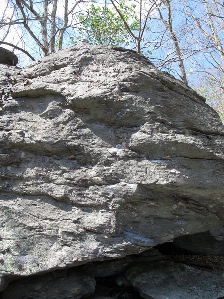 Buffalo Bill. Sit start impossibly low at the low chalked ledge under the short roof. Climb up and left to gain the high "chicken head."