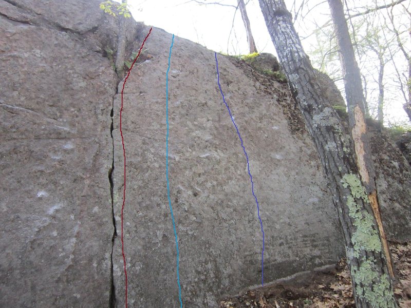 Breathing Space (Brown)Crack V0/5.7. Light blue V2. Hard move off the ground on crimps, easier climbing and delicate feet to the top. Purple (Slipping Away) V3. Hard moves off the ground to get to a rail, easier climbing to the top.