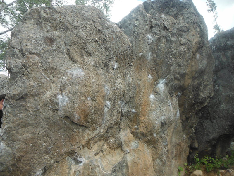 Slam Dunk on the left (near the arete), V4 in the middle, and DSR Drive on the right.