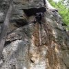 Climber rounding the P1 crux