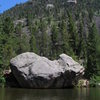 The Bog boulder in summer. Iron Helix starts in the dihedral on the right-hand side of the boulder and moves left.