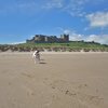 On the Beach . Bamburgh Castle. Northumberland coast