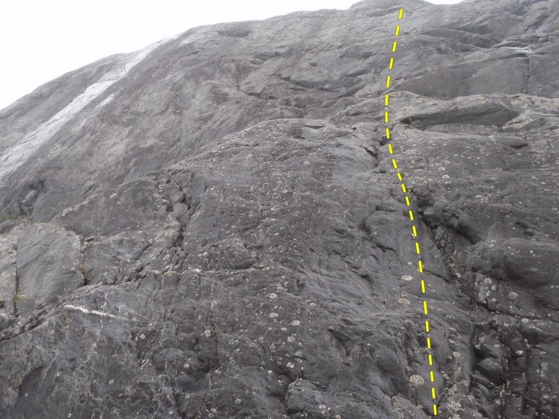 Start up the ledge and continue up the lighter colored rock