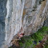 Fuzzy pic of Ben in the opening boulder problem.