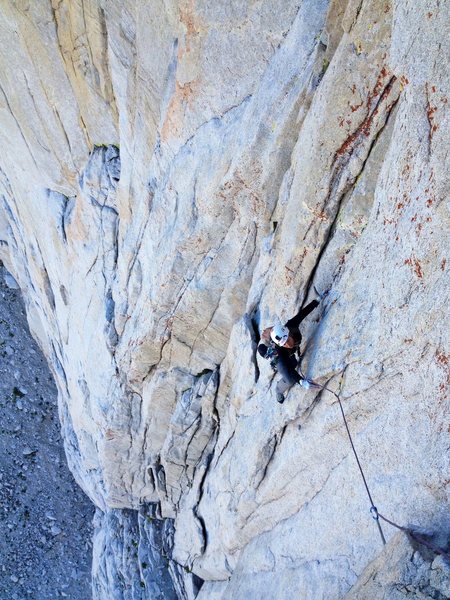 Amy Ness scoping out the first 5.11a crux on P3.