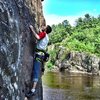 Taylor's first day of outdoor climbing in MN; halfway up Iron Ring aka Witches Tit on Angle Rock on a perfect July day.