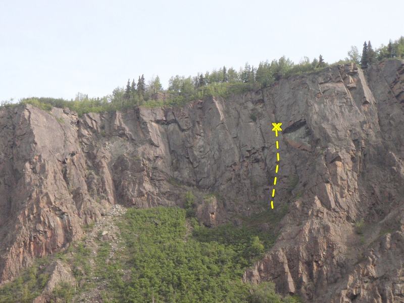 Soft Rock finishes 10' left of a large roof half way up the cliff.