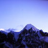 Summit of Mt. Huntington seen over the crest of the Rooster Comb