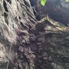 Looking up at Cafe Au Lait; the climber is inside the stemming cave.