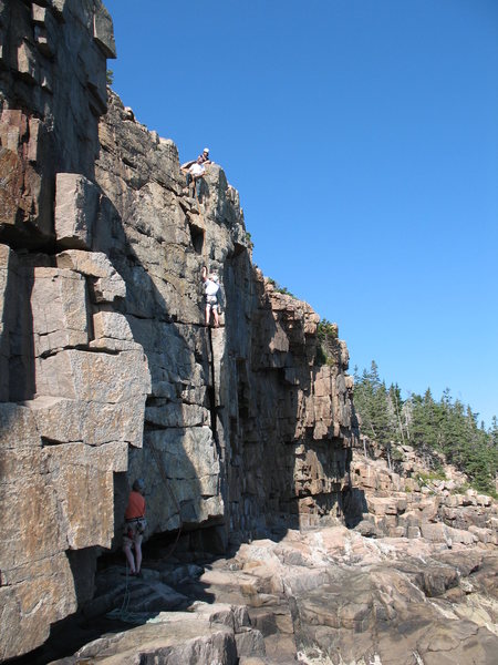 Climbing school on In the Groove. Note possible walk off to the right at low tide