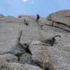 Second of four raps from S. Buttress.  Easy with single 70 m rope.  Consider angling climber's right at start of rappel to avoid pulling rope into dihedral on left.