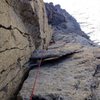 Peter Pribik following the crux P4 fists & OW  dihedral with the giant death block looming in the foreground