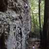 Under the bulge and heading up to the crux on Moonbeam 5.9 in Military Wall