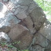 A couple variations exist on this face. This is one of the lower boulders.