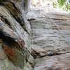 Looking up from the base of the climb. It's pretty thin until you get up to the point where the crack starts to curve back to the left (about half way up in this picture). 