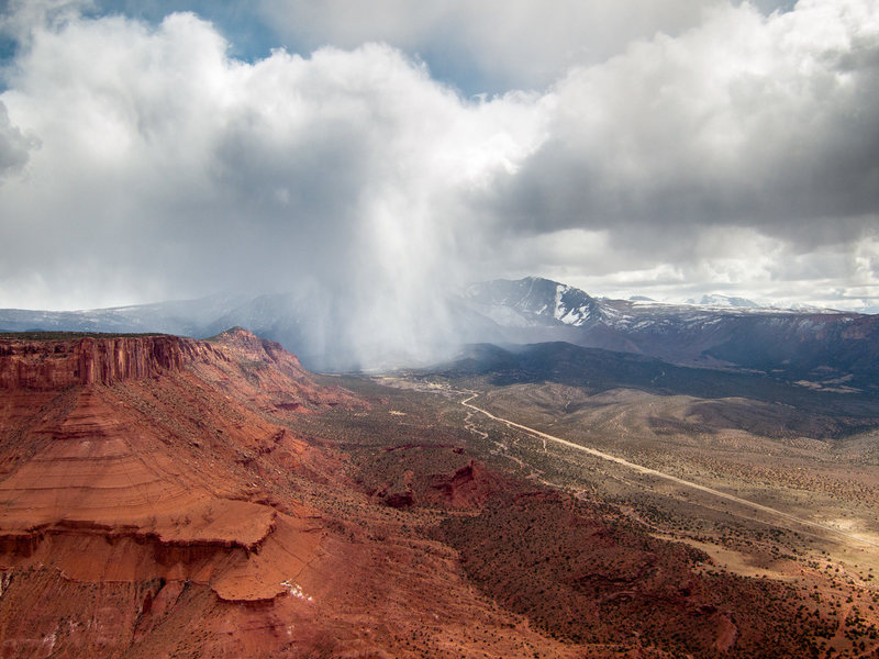 View of the storms blowing through Castle Valley from the top of Castleton Tower.