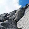 Crux pitch of NE Face, Pingora.  Photo credit: from a trip report by SuperTopo user PellucidWombat (http://www.supertopo.com/tr/Pingora-NE-Face/t12248n.html)<br>
<br>
Based on the below link to an MP.com discussion, the left-most crack is the 5.8 wide option; the thinner middle crack is the 5.9 option that eventually (i.e., mid-pitch) merges with the left-most crack.<br>
<br>
Over two days last July, 5 out of 6 parties instead went up the longer crack on the right which seems to be an independent and undocumented variation - at least 1 party unknowingly did so (perhaps all 5); I don't know how it compares to the other two options, but I thought it had some 5.10a/b move or two in it.  Perhaps others who have done it and another option will chime in on how they compare to each other.<br>
<br>
Link to MP.com discussion: http://www.mountainproject.com/v/crux-pitch-of-ne-face-pingora-which-way/109395485#a_109397003