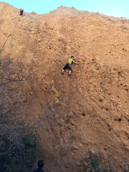 A newly minted leader climbing the bolted 5.7 route on the Acme TR Wall.