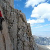 Richard Shore leading the crux P9. Photo by Johnny K