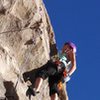 Nicole sizing up the short vertical section, which feels like a roof compared to the rest of the climb and is the crux of the first pitch. 