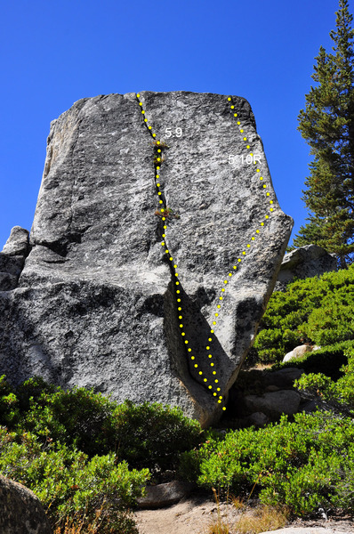 Backside of the Olmstead crack formation showing the 5.9 solo crack and the 5.10R boulder face problem.