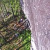 Looking down at the large treed ledge below A hatch.