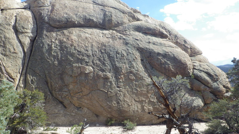 Double dome west face with obvious hourglass cracks.  This is the first face visible when hiking in from above it.