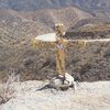 A cross has appeared on the east side of Rush Canyon Road, on the way to Texas Canyon, honoring Jake Gnasso, Ian Bulbenko, and April Townsend.  09-12-14
