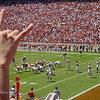 The slogan and hand signal of the University of Texas at Austin.