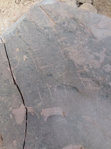 Faded, cracked plaque found at base of route. FA info unknown