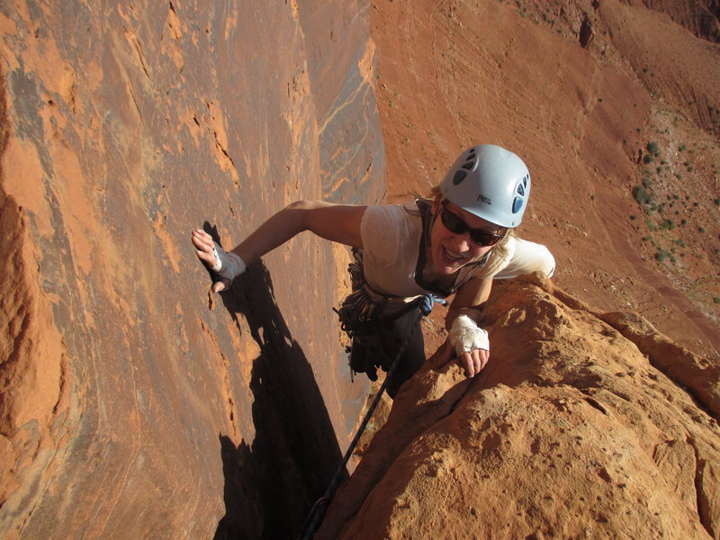 Kat happy to be past the wide, then tight section of the climb.  All smiles from here!