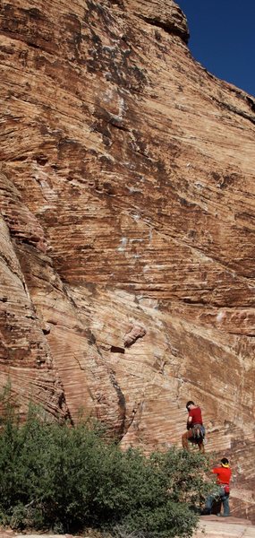 John starting out on Baseboy Direct, 5.11a.  The obvious chalk-covered line.