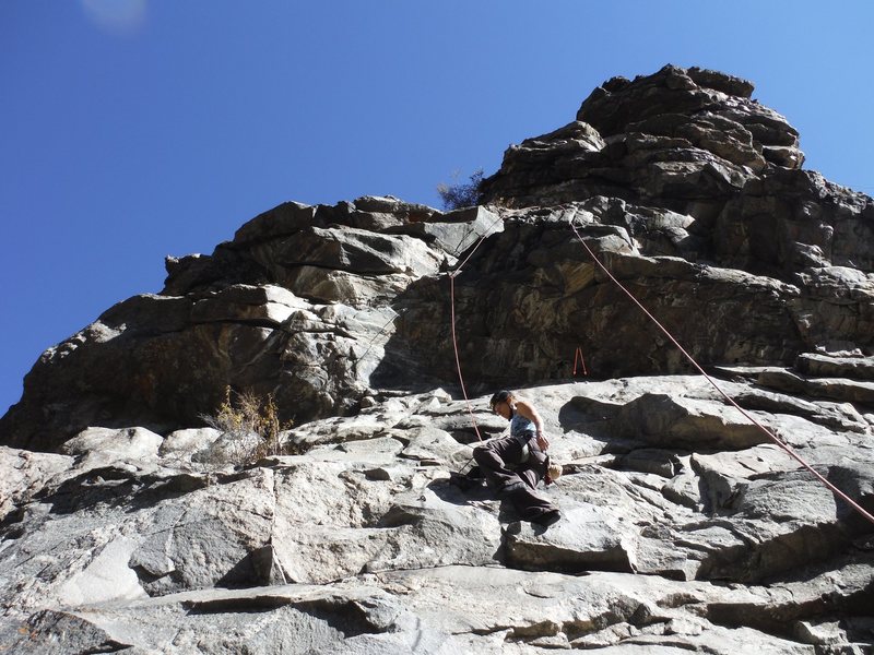 Top roping this section to get to the 5.10 above. Good warm up lead for the day. Two red arrows show the finish chains. 