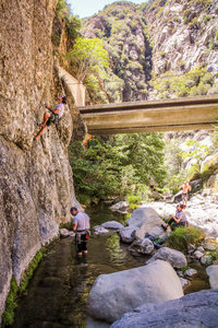 Andrew on a route in Wheeler Gorge, possible 5.12a? Belaying from the water