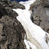 The cornice at the top of the climb. Cut left and hit the trail about 350' below the summit.