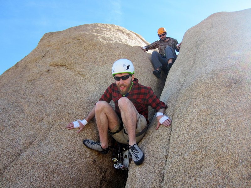 The butt chimney downclimb/walkoff, on the North side of the formation (climber's right at the top).