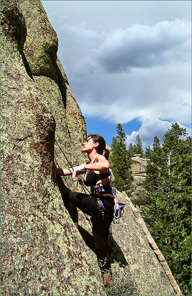 Tressa Mallamo is following the route, appropriately taped and wearing long tights/pants to avoid the moderate meatgrinder.  If you don't use both these (tape and long pants), you will definitely be forced to understand where the name of the climb came from. 