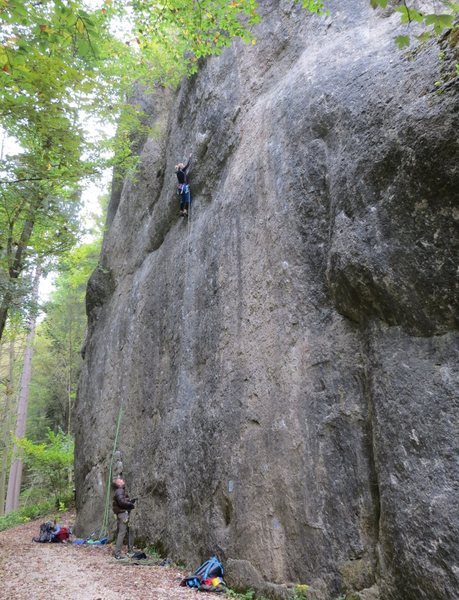 Ankatalwand.  The climber is on Yetisports, the bright green rope is on Computerspiele.  New Dimensions climbs the line just above the blue backpack (immediately right of Yetisports.