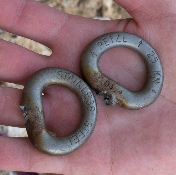 These glue-in bolts, ~10 years old, broke with a tap of a hammer.  Notice the sharp edges and granular surface at the break.   There's no ductile (pulled taffy) material which indicates they were completely cracked through before being struck. 