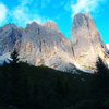 The West face from the meadow with the South Face Tissi route on the right skyline