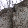 Topping out and anchoring to the trees.  The last 10 feet is a dirt slope.  There is a root that can be threaded to the right, but is not needed when conditions are dry.