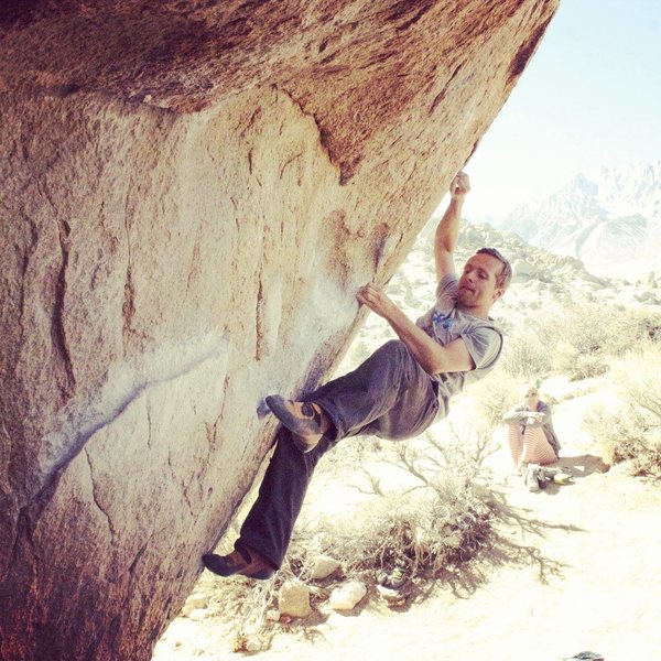 Searching for the right foot hold for the crux move